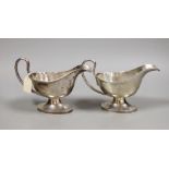 A pair of George V silver pedestal sauceboats, William Hutton & Sons, Sheffield, 1916, 11.4oz.