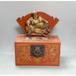 A Chinese lacquered wood Budai carving, 34 cm wide, and a Chinese lacquered wood box (2)