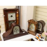 Two domed mantel clocks, a Connecticut shelf clock and a Black Forest mantel clock