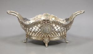 A late Victorian Hanau? pierced silver two handled bowl, embossed with busts, import marks for