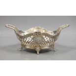 A late Victorian Hanau? pierced silver two handled bowl, embossed with busts, import marks for