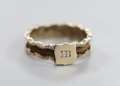 A 19th century yellow metal and plaited hair set band, the ring head with engraved monogram, size