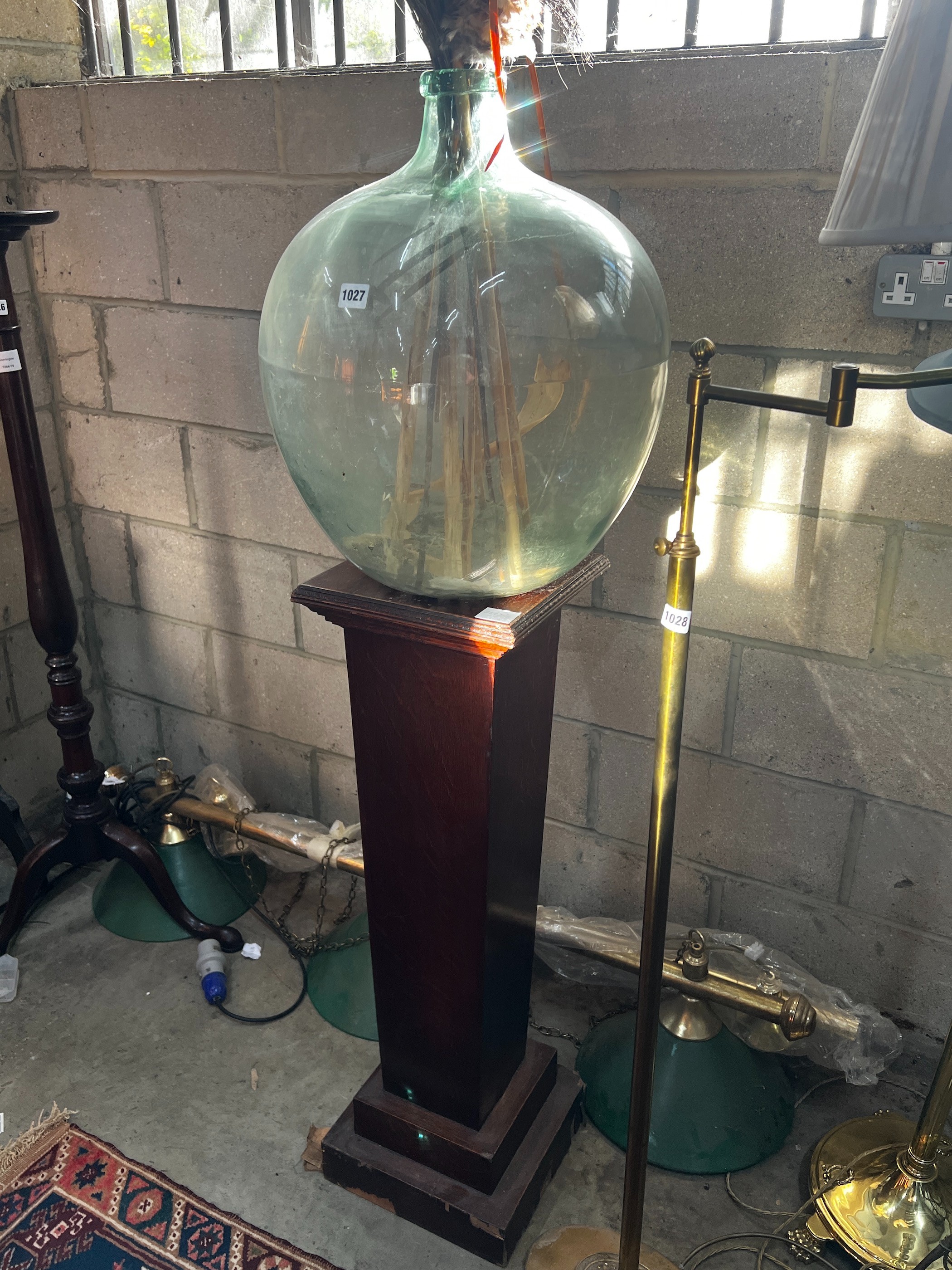 An early 20th century oak pedestal and a green glass carboy, combined height 150cm - Image 2 of 2