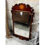 A George III style mahogany fret cut wall mirror, width 52cm, height 90cm