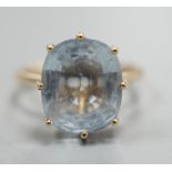 A 9ct gold and oval cut aquamarine set dress ring, size P/Q, gross weight 4.3 grams, the stone