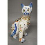 A Mosanic faience model of a seated cat, 31cms high