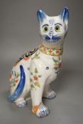 A Mosanic faience model of a seated cat, 31cms high