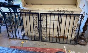 A pair of painted wrought iron garden gates, each gate width 101cm, height 99cm together with a