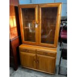 An Ercol elm 'Windsor' glazed side cabinet, width 91cm, depth 43cm, height 162cm