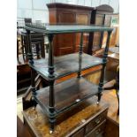 A late Victorian ebonised and amboyna three tier whatnot, width 66cm, depth 39cm, height 81cm