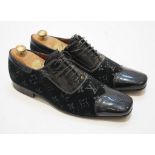 A pair of gentleman's Louis Vuitton black velvet and patent leather evening shoes, size 8.