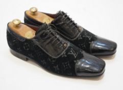 A pair of gentleman's Louis Vuitton black velvet and patent leather evening shoes, size 8.