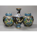 A pair of early 20th century Chinese cloisonné enamel ‘dragon’ jars and covers and a similar vase.