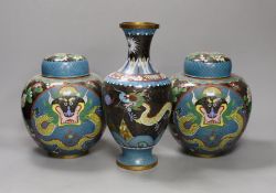 A pair of early 20th century Chinese cloisonné enamel ‘dragon’ jars and covers and a similar vase.