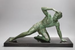 J. De Roncourt, bronze, of a reclining male on black marble stand, 49cms