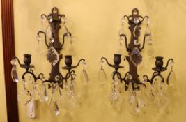 A pair of late 19th century French bronze metal and cut glass twin branch and wall lights, height to