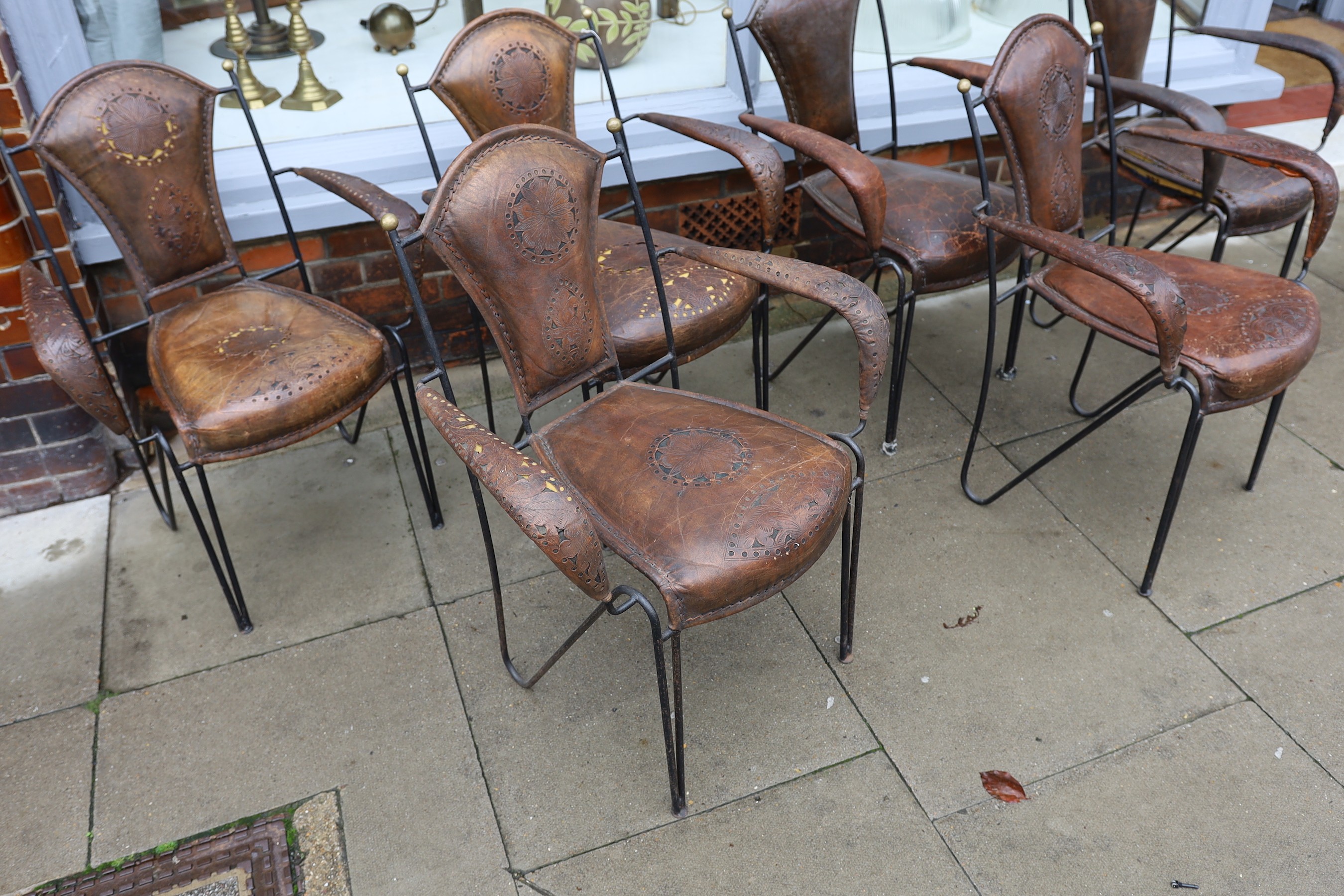 A set of six French wrought iron and brown leather elbow chairs, with brass ball finials, four - Image 3 of 5