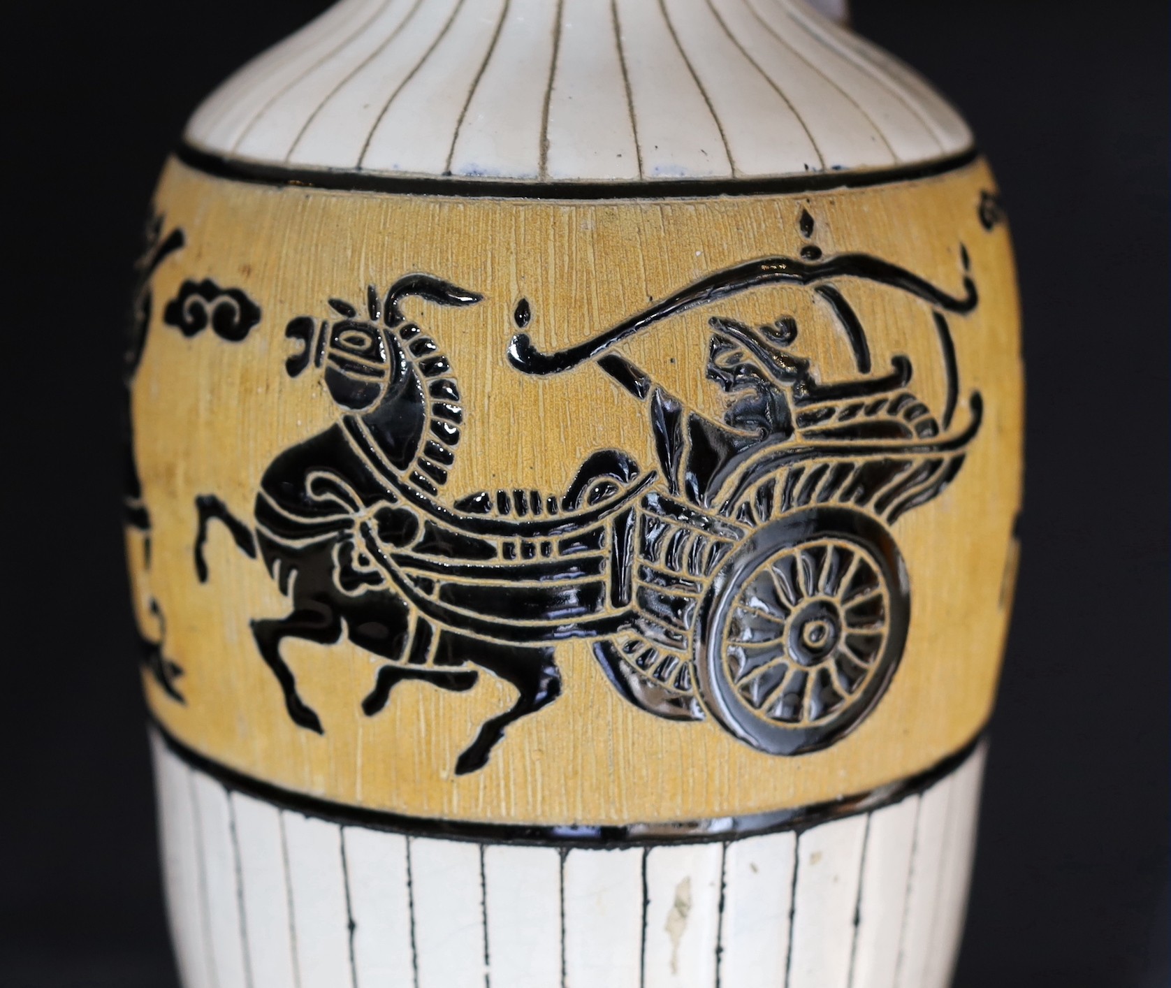 A 20th century Continental tinglazed pottery table lamp, decorated within a band of horse riders and - Image 3 of 5