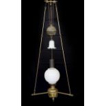 A Victorian Hinks brass counterbalanced hanging oil lamp with opaque glass shade and fluted