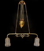 An Edwardian brass counter balanced light fitting with frosted glass shades etched with Grecian