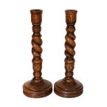 A pair of carved wood barley twist candlesticks, height 46cm