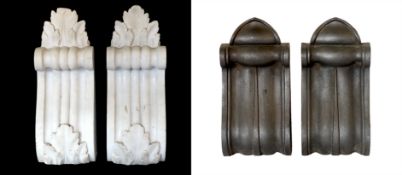 A pair of Victorian cast iron corbels and a pair of carved white marble corbels, height 26cm &