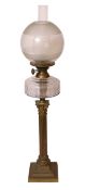 An Edwardian brass Corinthian column oil lamp with glass reservoir and etched glass shade, height