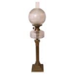 An Edwardian brass Corinthian column oil lamp with glass reservoir and etched glass shade, height