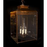 A large traditional style square bronzed metal and glass hall lantern, height 76cm. width 38cm