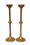 A pair of early 20th century English brass altar sticks, height 61cm