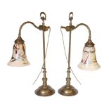 A pair of Edwardian style brass desk lamps with loetz style glass shades, height 61cm***CONDITION