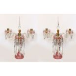 A pair of Victorian opaque pink and white glass lustre candelabra, with spear shaped finials and cut