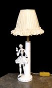 A 1950s German ceramic table lamp modelled with a gallant, height 30cm.
