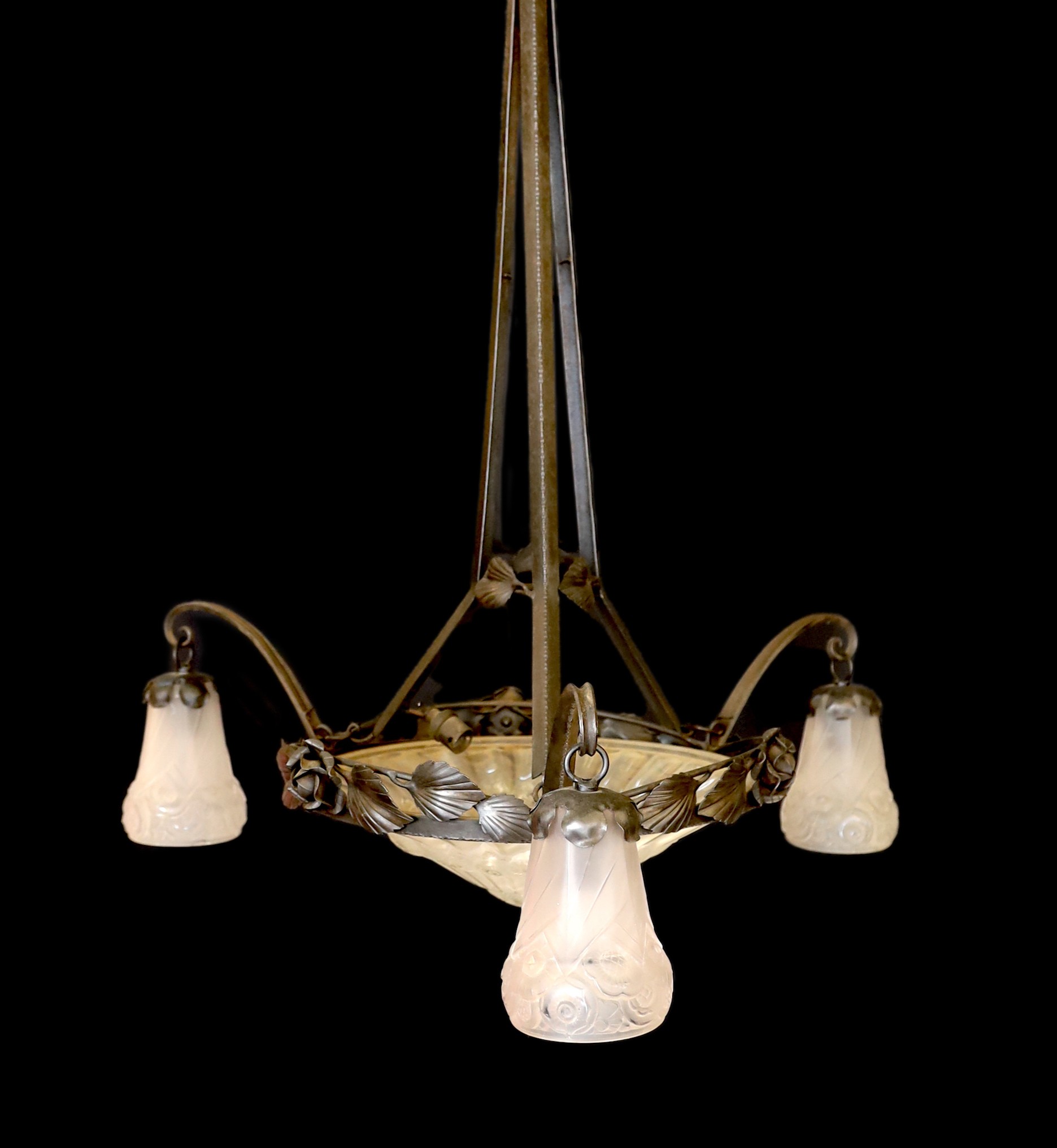 A 1930s French wrought iron and frosted glass light fitting, in the manner of Edgar Brandt with