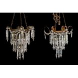 A pair of early 20th century art glass three light lustre light fittings with spear shaped drops,
