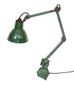 A green painted and enamelled metal adjustable workbench lamp, height 37cm to the bend