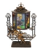 An early 20th century English wrought iron and stained-glass hexagonal lantern style table lamp with