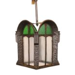 A 1930s Swiss pressed iron, rippled and stained glass hall lantern, height 80cm. width 26cm