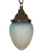 A 1920's English bronzed metal light pendant with blue tinted frosted glass shade, height 22cm***