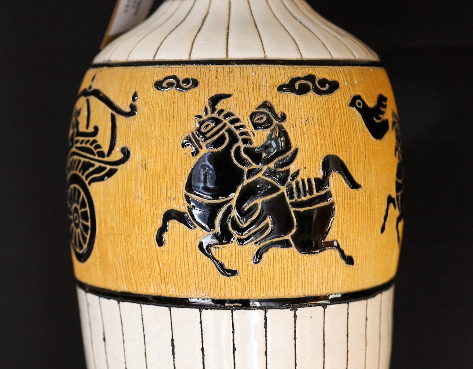 A 20th century Continental tinglazed pottery table lamp, decorated within a band of horse riders and - Image 4 of 5