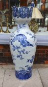 A large Chinese blue and white vase with lobed pierced rim, decorated with exotic birds on prunus
