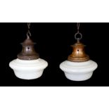 A pair of 1930s English copper ceiling lights with a Siemens Transcenda opaque glass shades,