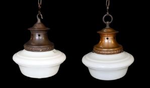 A pair of 1930s English copper ceiling lights with a Siemens Transcenda opaque glass shades,