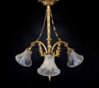 A 20th century French gilt brass three light chandelier with cut glass shades, height 60cm. width