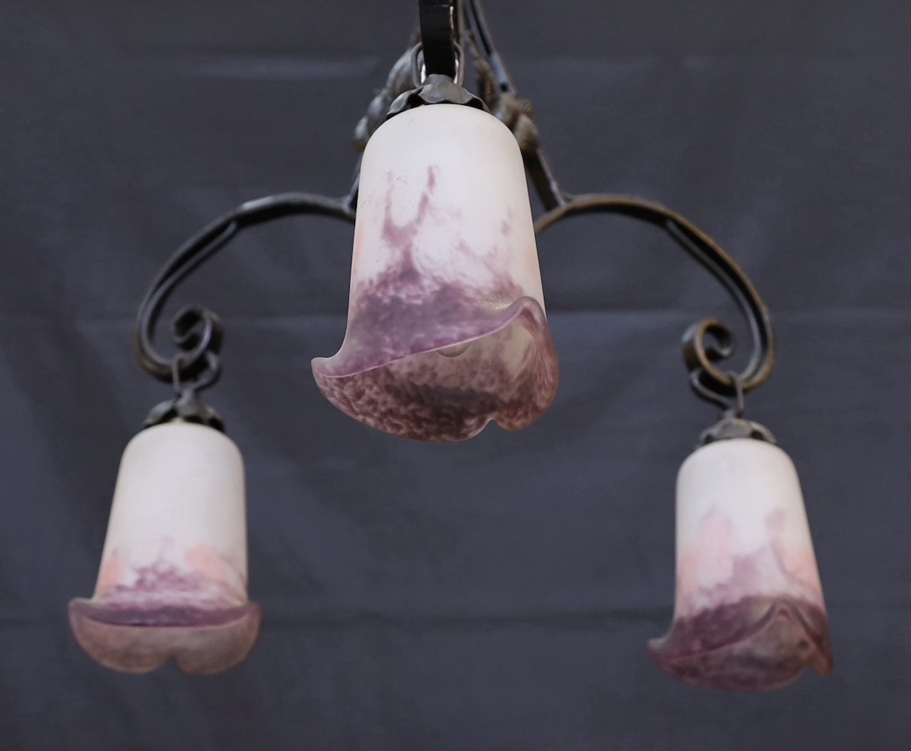 A 1920s French wrought iron three branch light fitting with marbled and frosted glass shades, height - Image 3 of 3