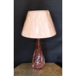 A 1960s Val Saint Lambert cranberry tinted glass table lamp, of twisted form, with replacement