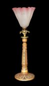 An early 20th century Danish carved and glass bead inset wood lamp base with brass flowerhead