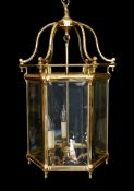 A large 18th century style hexagonal brass hall lantern with bevelled glass panels, height 78cm.