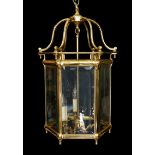 A large 18th century style hexagonal brass hall lantern with bevelled glass panels, height 78cm.