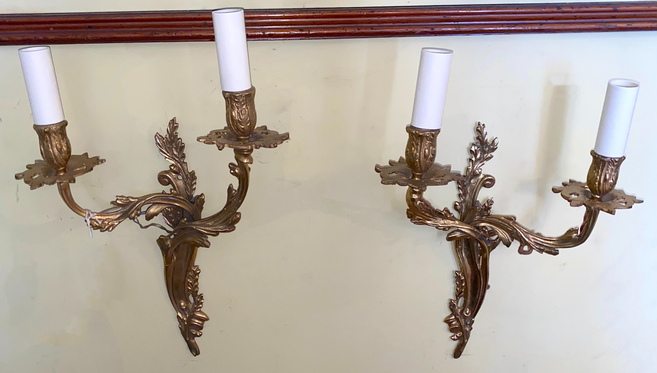 A pair of Louis XVI style ormolu twin branch wall lights, height 42cm, width 28cm